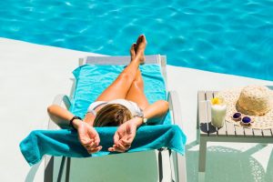woman relaxing poolside