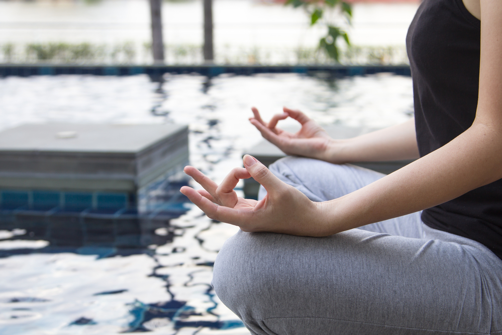 Yoga Session Besides Pool